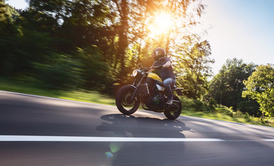 motorbike on the road riding. having fun riding the empty road on a motorcycle tour / journey
