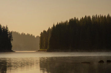 Magic sunrise by the dam lake in Rhodope mountain, Bulgaria. 