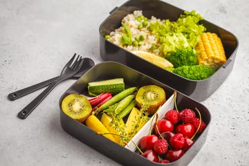 Gordijnen Healthy vegan meal prep containers with brown rice, broccoli, vegetables, fruits and berries © vaaseenaa