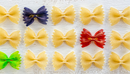 raw Italian pasta Farfalle - abstract vision be different, unique personality or standing out from the crowd, leadership quality. beautiful still life background 