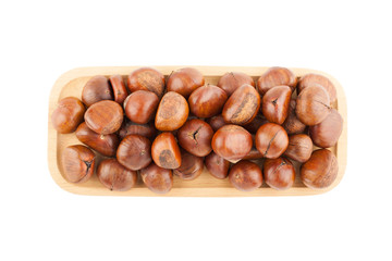 Top view angle of chestnut in wooden plate