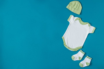 Baby Clothing. Hat and socks. Concept of newborns, motherhood, care, lifestyle.
