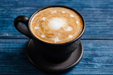 Cup of coffee with a lot of beautiful latte art.