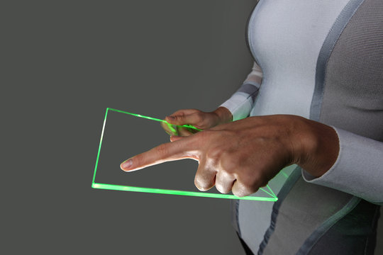 Hands holding blank futuristic transparent tablet pc - Powered by Adobe