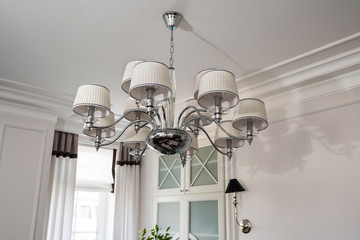 Light chandelier in an interior.