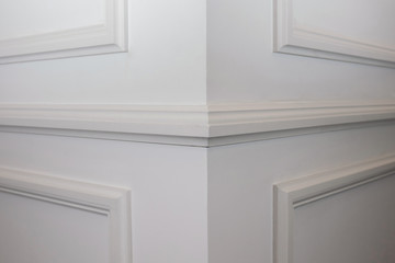 Ceiling moldings in the interior, detail of a angular wall skirting