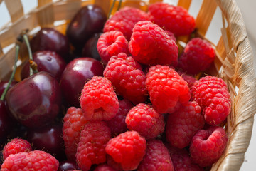 Raspberries and cherries close-up.