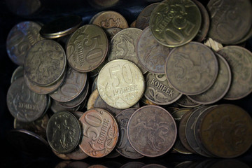 A lot of Russian coins at 50 cents close-up. Russian money horizontally