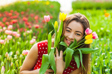 Beautiful woman with colourfull tulips