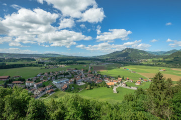 View from the castle of Gruyeres into the valley below surrounded by beautiful alps.