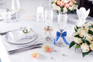 Plate at the wedding table with glass on white