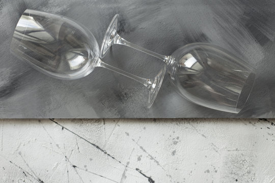 Empty wine glasses on a gray background