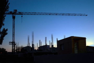 construction of a residential house at sunset, against the background of the already constructed