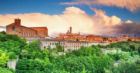 Scenery of Siena, a beautiful medieval town in Tuscany, with view of the Dome & Bell Tower of Siena Cathedral (Duomo di Siena), landmark Mangia Tower and Basilica of San Domenico,Italy