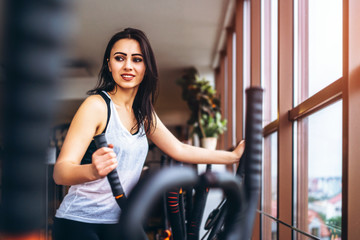 Cute sporty girl workout in the gym