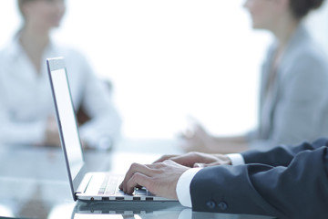 closeup of businessman typing on laptop.