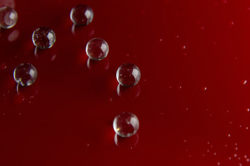 The abstract  crystal ball on red glossy floor background.