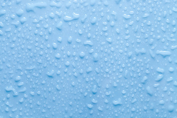 Texture of water drops on blue background