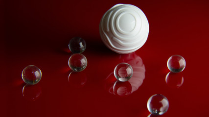 The abstract  crystal ball on red glossy floor background.