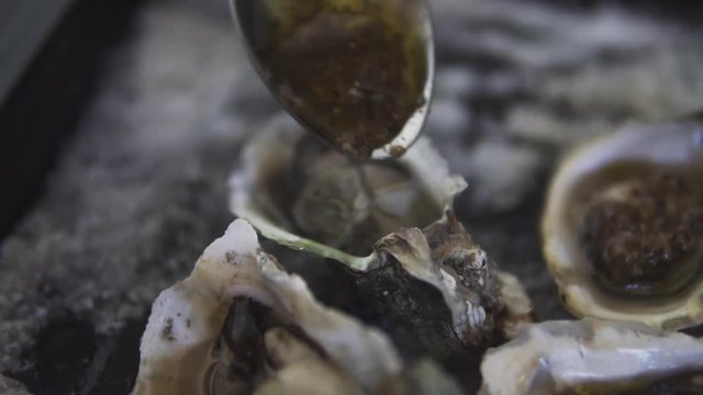 Healthy seafood, closeup fresh open oyster with sause