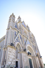 Facade of the Cathedral of Orvieto (Duomo di Orvieto) Italy. Construction in Gothic style dedicated...