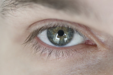 Male eye, close-up. Healthy vision. Look ahead.