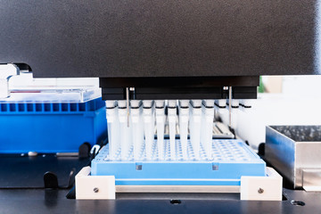 Automation in the clinical laboratory. Pipetting robot laboratory. Medicine robotics. NGS DNA...
