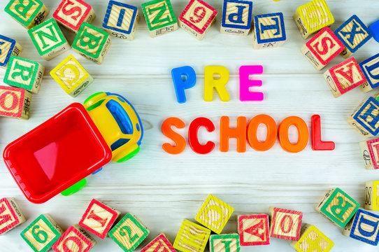 Truck Toy And Alphabet Letters With Arrangement Of Pre School Wording. Pre School, Back To School And Kindergarten Concept.