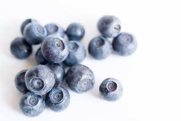 Blueberries on a white background close up, soft focus. Summer wild berry
