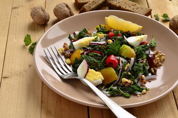 Salad with nettles, egg, sweet pepper, onion and  walnut