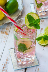 Pink rose lemonade with lime and fresh mint. Refreshing summer non-alcoholic drink.
