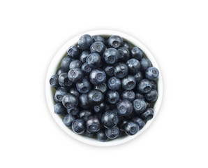 Top view. Bilberres in a bowl isolated on white. Ripe blaeberries with copy space for text. 