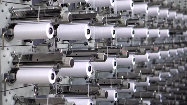 Fabrication and winding of flat thread. The heated mixture passes through the nozzle in the form of a thin film, and  is cut into flat threads of the required thickness, pulled and wound on the coil.