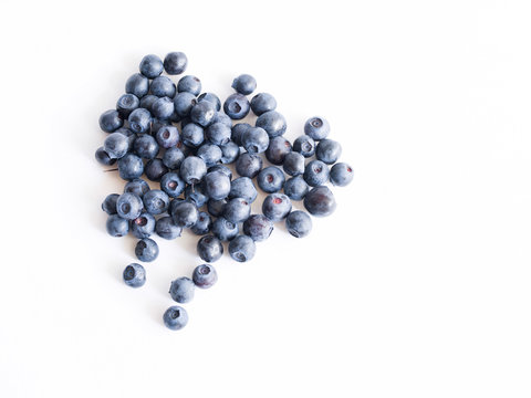 Fresh blueberries on a white background close up, soft focus. Summer wild berry
