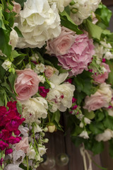 Wedding flowers decoration on brown wooden fence.