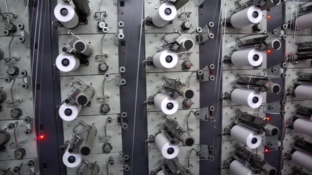 Fabrication and winding of flat thread. The heated mixture passes through the nozzle in the form of a thin film, and  is cut into flat threads of the required thickness, pulled and wound on the coil.