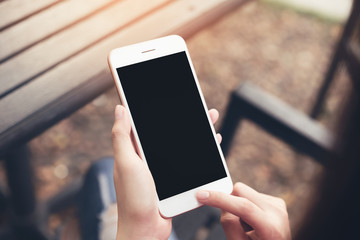 Woman using blank screen smartphone. screen for the graphics. Concepts for Digital Technology in Everyday Life.