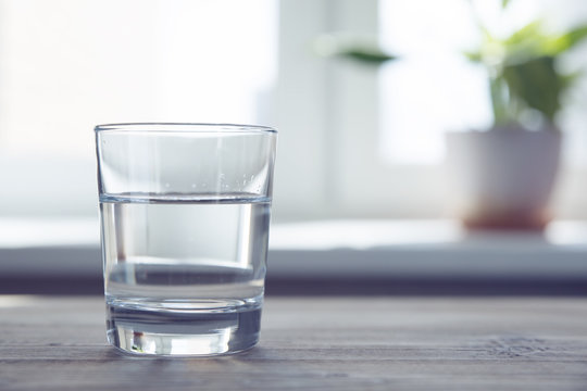 a glass of water on a table