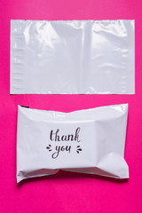 polyethylene envelope on pink background