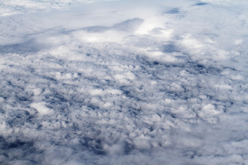 Sunrise above clouds from airplane window