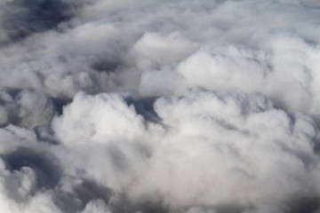 Sunrise above clouds from airplane window