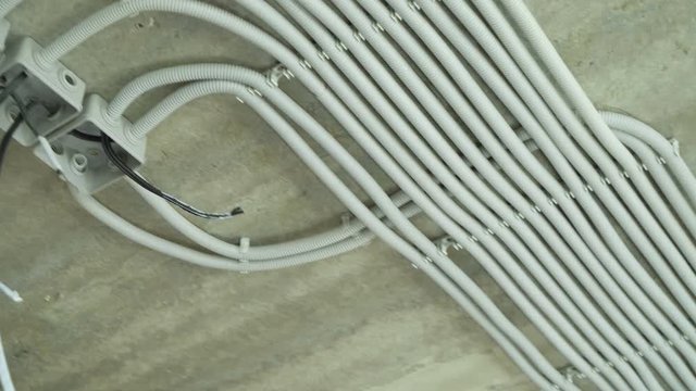 Electrical installation of plastic tubes on building site. Fix boxes, fire prevention cable tray wiring channels indoors, excellent electrical insulation. Living rooms electricity network connection