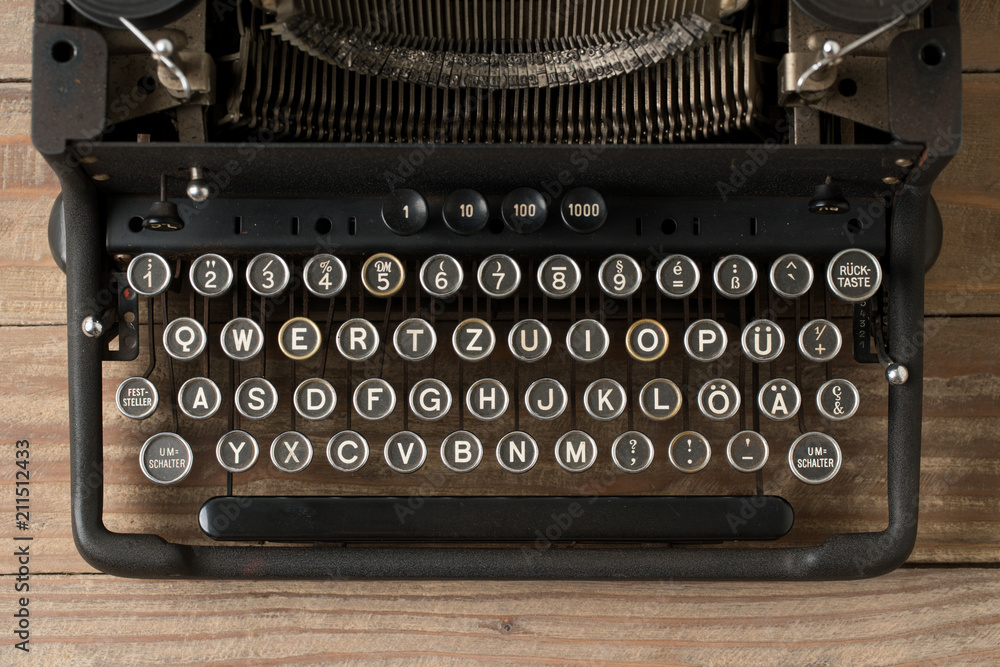 Poster top view of retro style typewriter in studio