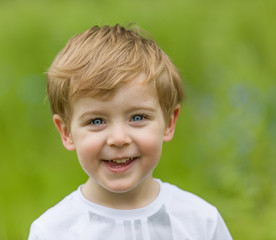 Happy little boy having fun at the park