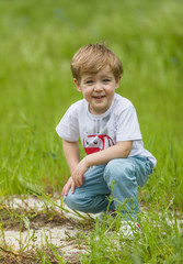 Happy little boy having fun at the park