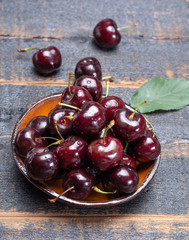Giant fresh ripe black cherries, new harvest, ready to eat close up