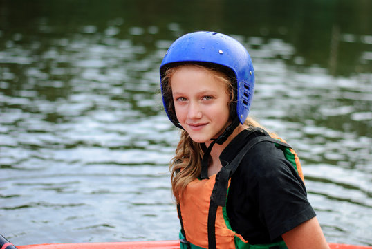 Portrait young teenage girl on a sports kayak boat