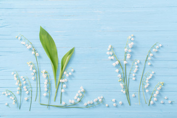 lilies of the valley on  wooden background