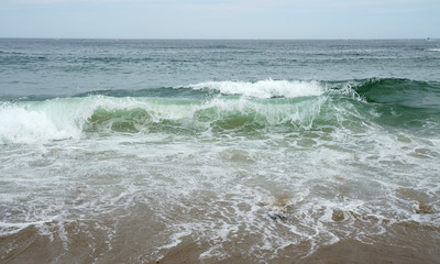 Fototapeta na wymiar close up on sea wave and beach