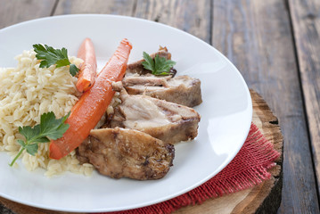 Macaroni with chicken breast and boiled carrots, close-up
